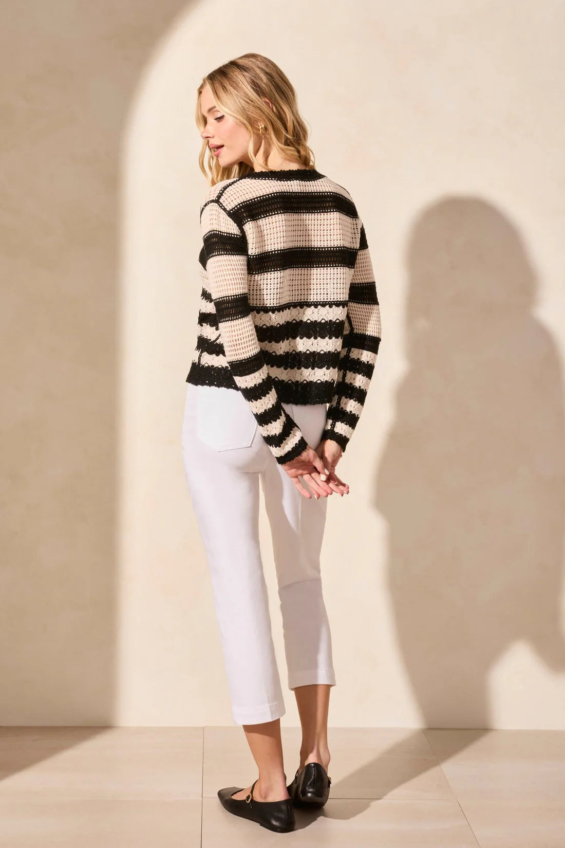 Top your ensemble with this cozy button-front cardigan showcasing a statement stripe pattern. The boxy fit keeps it comfortable as you layer it over your look, and long sleeves keep you covered.