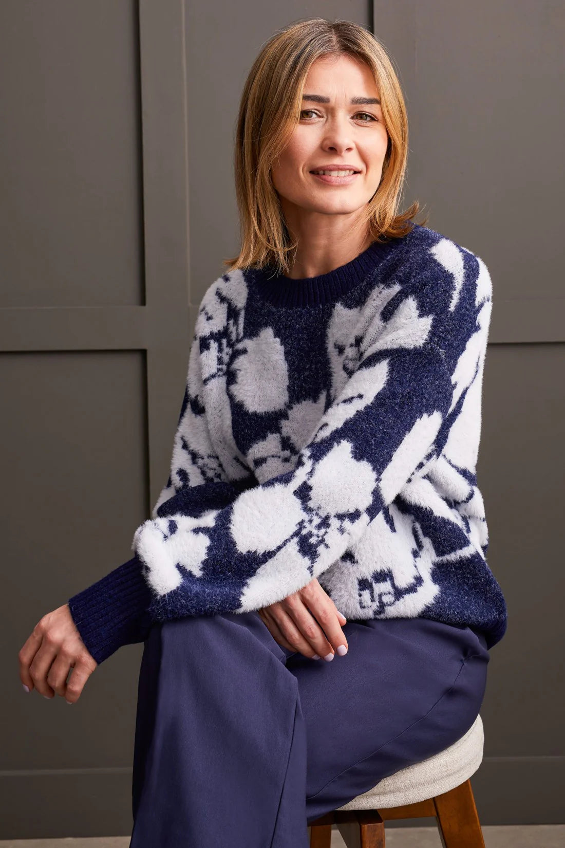 Experience luxurious comfort and style with our crew neck sweater. Crafted from ultra-soft double-knit eyelash yarn, it surrounds you in cozy warmth. Featuring long puff sleeves and a chic floral intarsia pattern, it's the perfect blend of comfort and fashion.