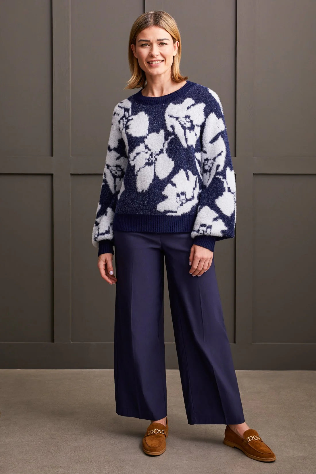 Experience luxurious comfort and style with our crew neck sweater. Crafted from ultra-soft double-knit eyelash yarn, it surrounds you in cozy warmth. Featuring long puff sleeves and a chic floral intarsia pattern, it's the perfect blend of comfort and fashion.