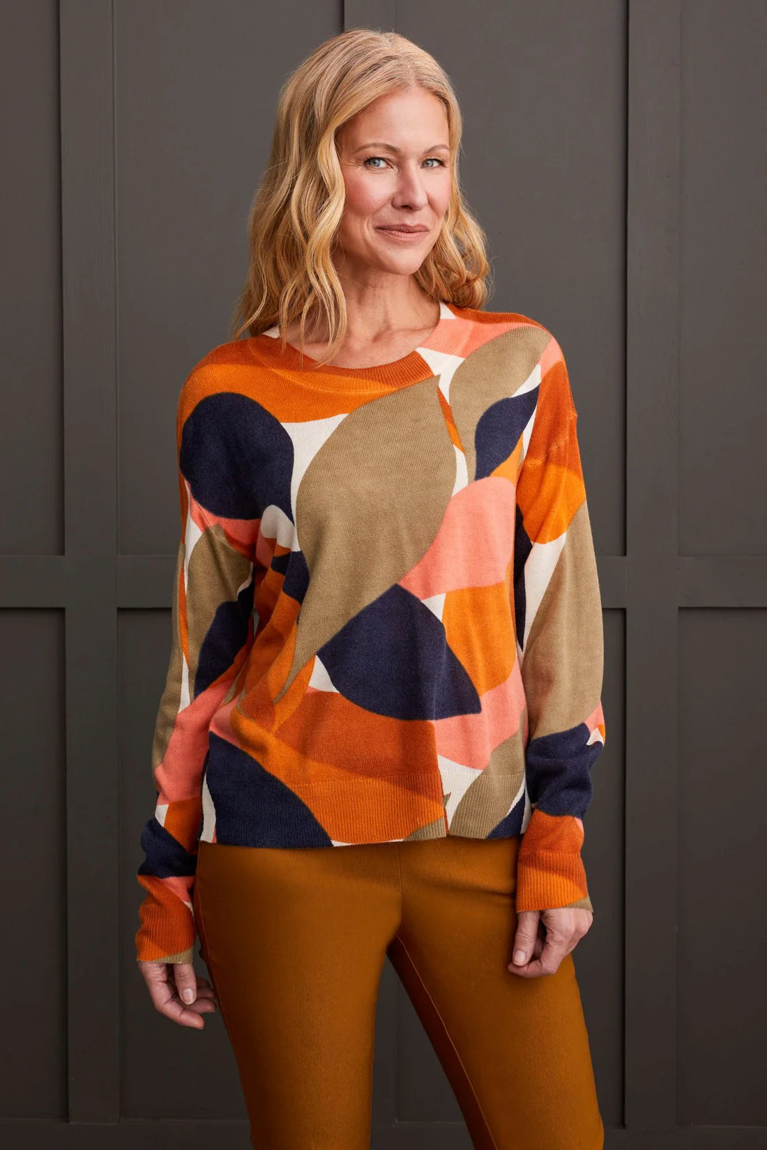 Select a striking style that captivates with this vibrantly patterned crew neck sweater. Its bold, all-over print is guaranteed to turn heads, while the fine gauge knit yarn provides a soft and stretchy feel, ensuring you stay comfortably stylish throughout the day and night.