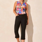 Step out into the sunshine in these classic capri pants, designed with a flattering slim leg fit and Flatten It® Technology to enhance your silhouette. The pull-on style allows for quick and easy dressing, while the stretch twill fabric provides all-day comfort. A rounded side slit adds a stylish accent to the hem.