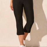 Step out into the sunshine in these classic capri pants, designed with a flattering slim leg fit and Flatten It® Technology to enhance your silhouette. The pull-on style allows for quick and easy dressing, while the stretch twill fabric provides all-day comfort. A rounded side slit adds a stylish accent to the hem.