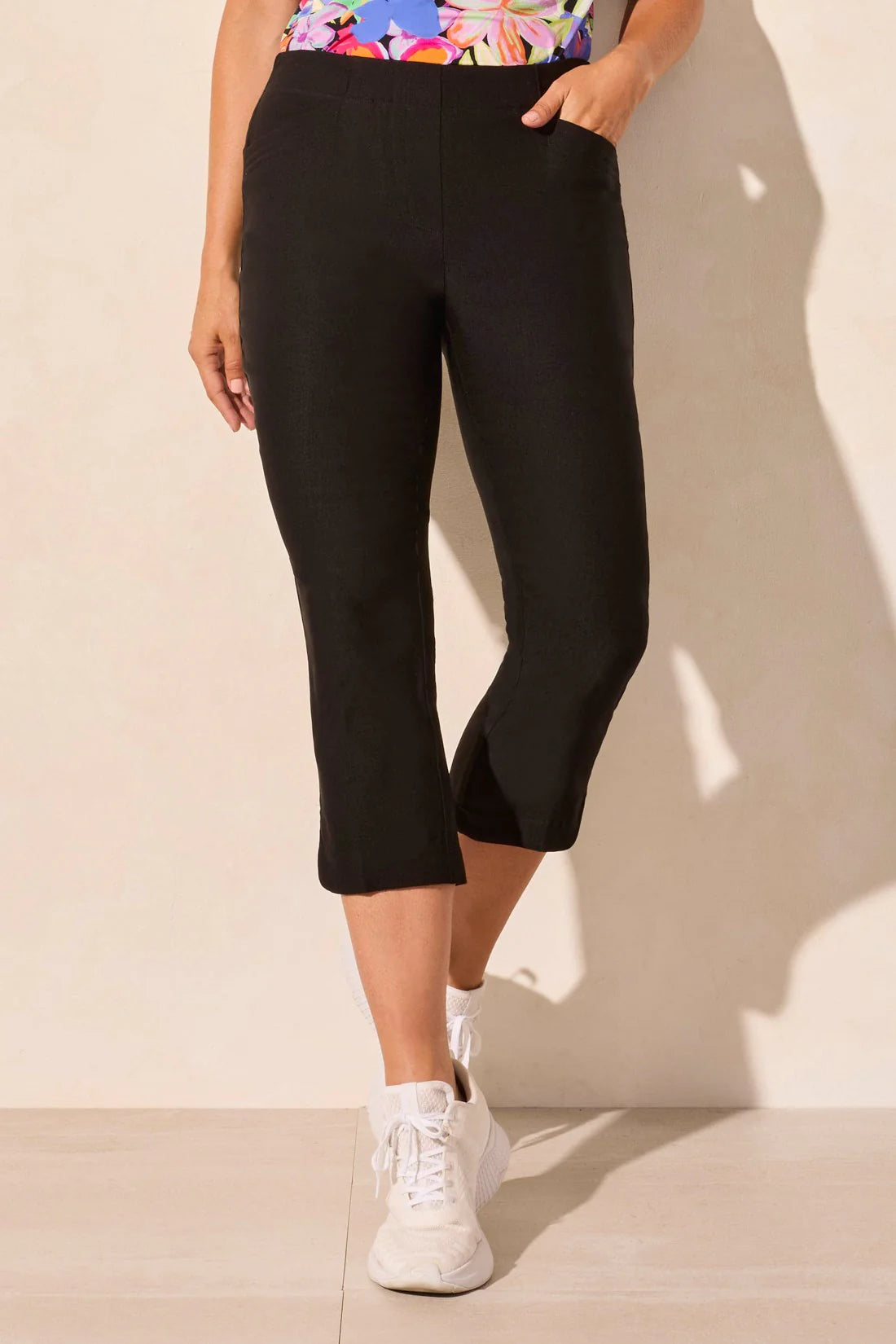 Step out into the sunshine in these classic capri pants, designed with a flattering slim leg fit and Flatten It® Technology to enhance your silhouette. The pull-on style allows for quick and easy dressing, while the stretch twill fabric provides all-day comfort. A rounded side slit adds a stylish accent to the hem.