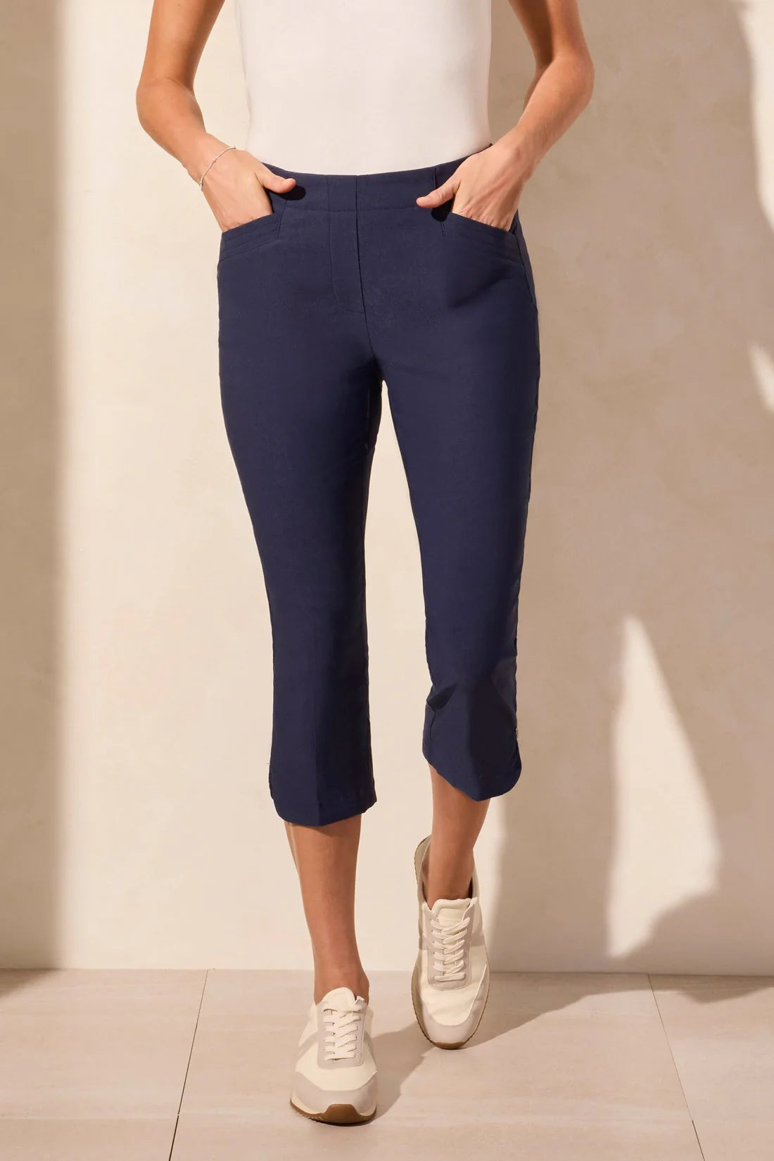 Step out into the sunshine in these classic capri pants, designed with a flattering slim leg fit and Flatten It® Technology to enhance your silhouette. The pull-on style allows for quick and easy dressing, while the stretch twill fabric provides all-day comfort. A rounded side slit adds a stylish accent to the hem.