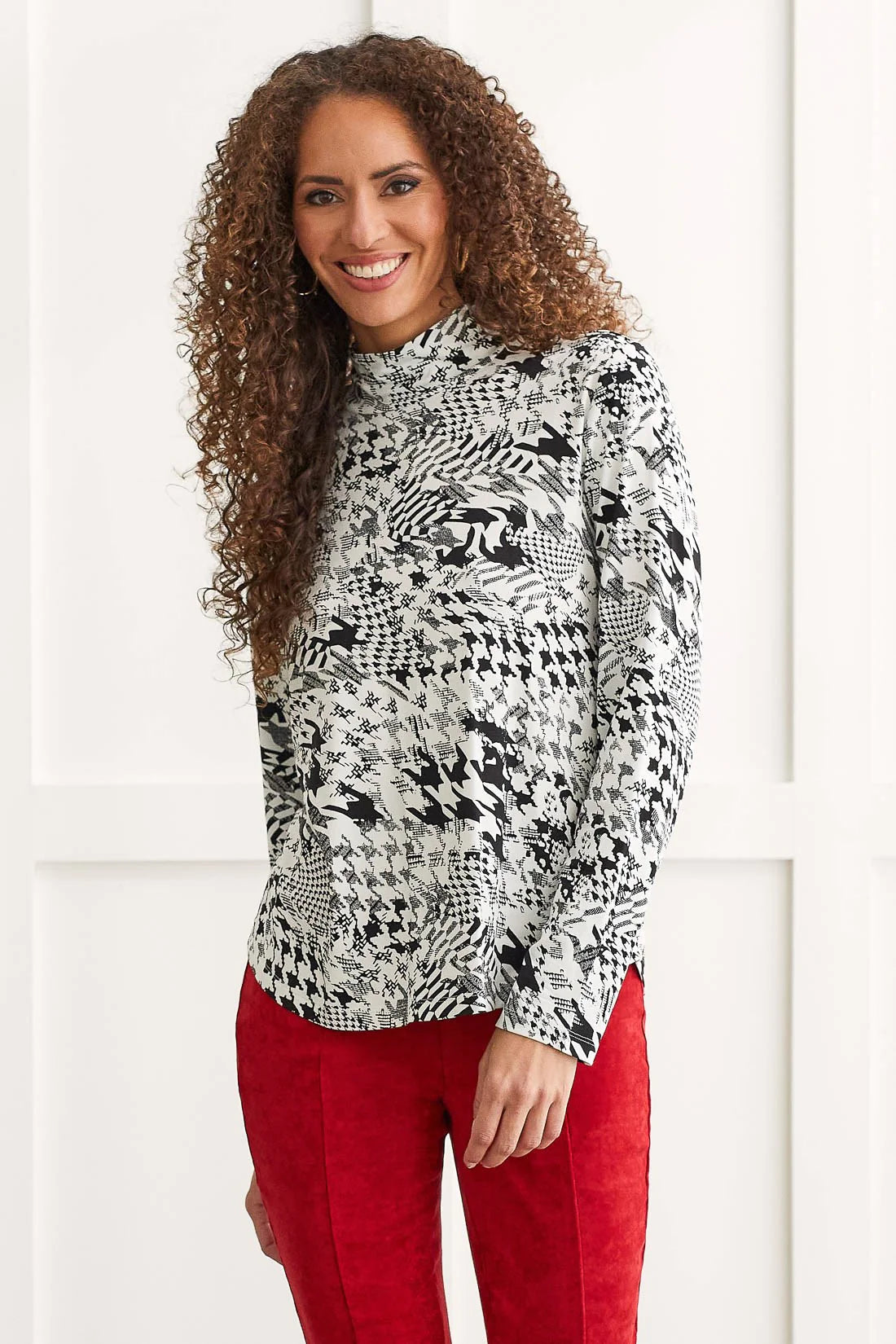 You're a force to be reckoned with and this long-sleeve top is the perfect companion to showcase your fierceness. We're crushing on the elevated mock neckline, all-over pattern printed on stretchy jersey fabric, and scooped hem that gives it a flattering finish.