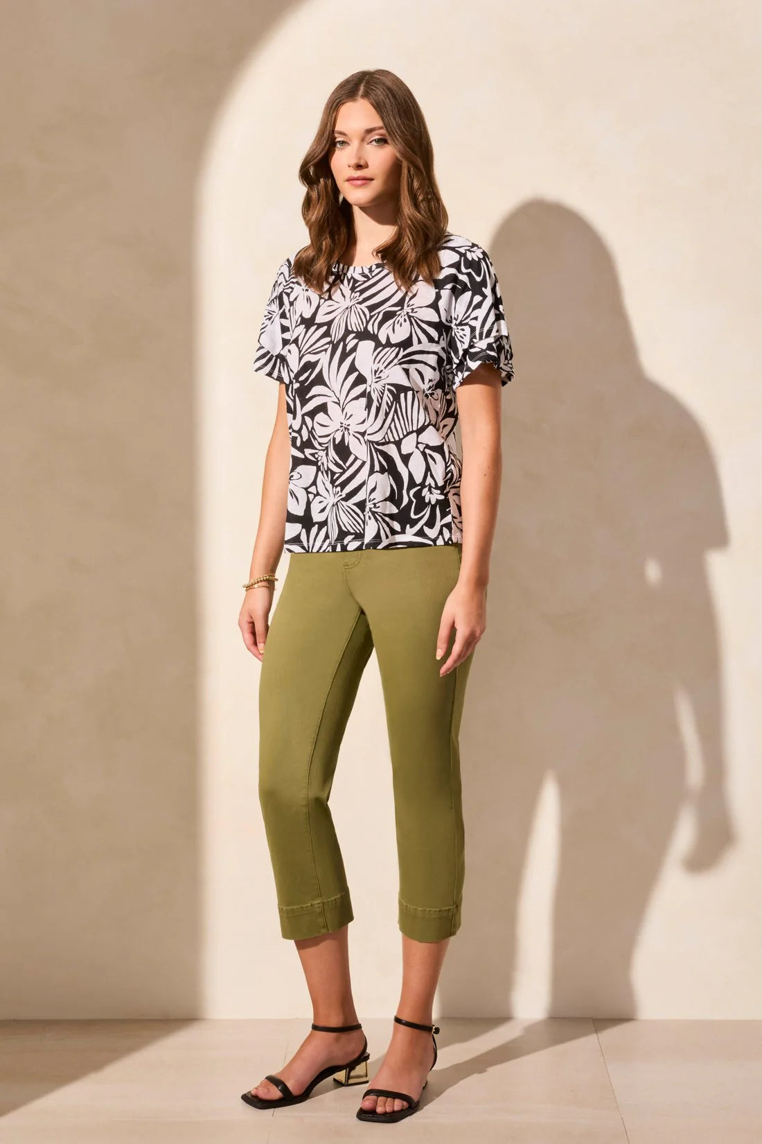 Experience the breathable comfort of this linen-blend top, crafted from soft jersey knit. Raglan armholes provide ease of movement and a relaxed fit, while the statement pattern adds eye-catching flair. Ruffle short sleeves complete your everyday style with a stylish flourish