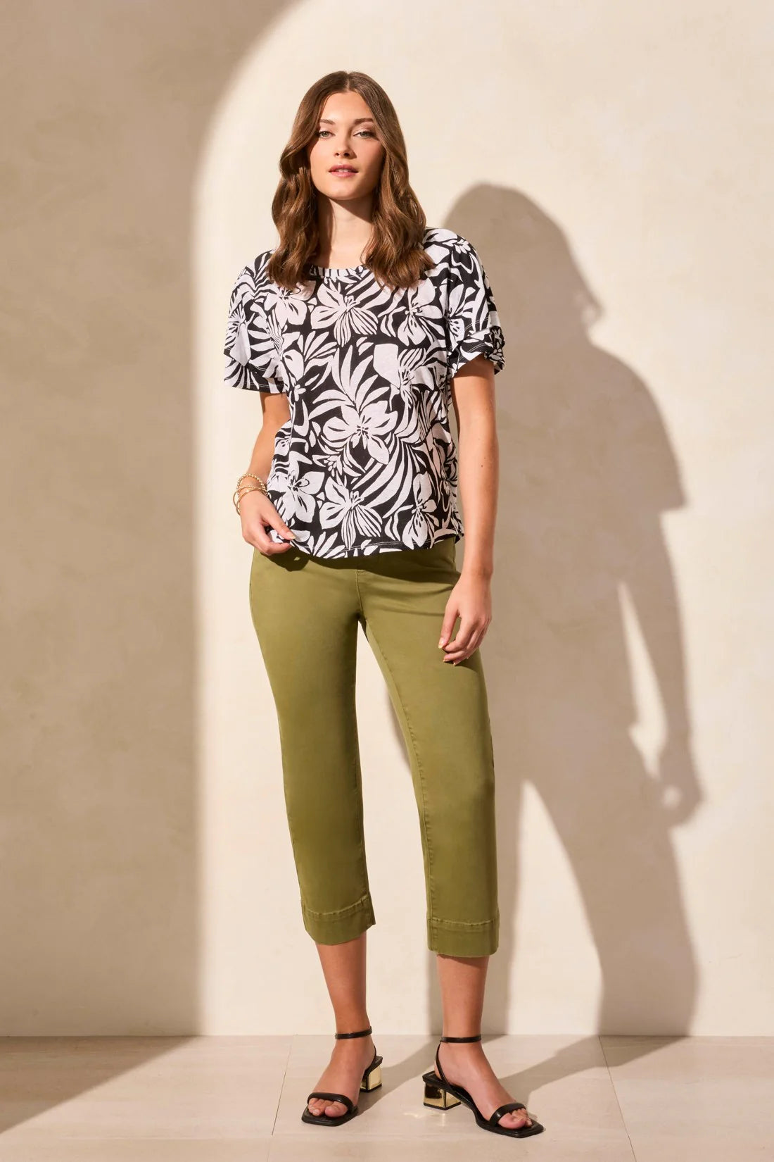 Experience the breathable comfort of this linen-blend top, crafted from soft jersey knit. Raglan armholes provide ease of movement and a relaxed fit, while the statement pattern adds eye-catching flair. Ruffle short sleeves complete your everyday style with a stylish flourish