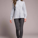 Cooler days call for this cozy sweater, crafted from a soft blend yarn with a rich texture for a luxurious feel. A sleek mock neckline and long puff sleeves add effortless elegance, while fitted cuffs create a refined finish.