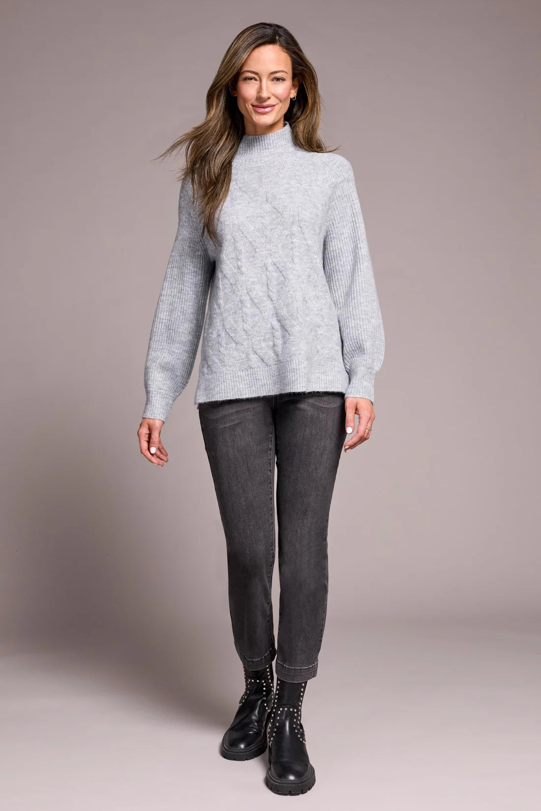 Cooler days call for this cozy sweater, crafted from a soft blend yarn with a rich texture for a luxurious feel. A sleek mock neckline and long puff sleeves add effortless elegance, while fitted cuffs create a refined finish.