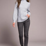 Cooler days call for this cozy sweater, crafted from a soft blend yarn with a rich texture for a luxurious feel. A sleek mock neckline and long puff sleeves add effortless elegance, while fitted cuffs create a refined finish.