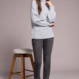 Cooler days call for this cozy sweater, crafted from a soft blend yarn with a rich texture for a luxurious feel. A sleek mock neckline and long puff sleeves add effortless elegance, while fitted cuffs create a refined finish.