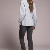 Cooler days call for this cozy sweater, crafted from a soft blend yarn with a rich texture for a luxurious feel. A sleek mock neckline and long puff sleeves add effortless elegance, while fitted cuffs create a refined finish.