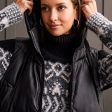 An off-season essential that serves up style points and practical performance. This zip-up puffer vest features a loose fit, chevron quilting, and a hooded neckline that surrounds you with cozy comfort, a 38" long design, front welt pockets, and zippered side seams that allow for more ventilation and moveability when required.