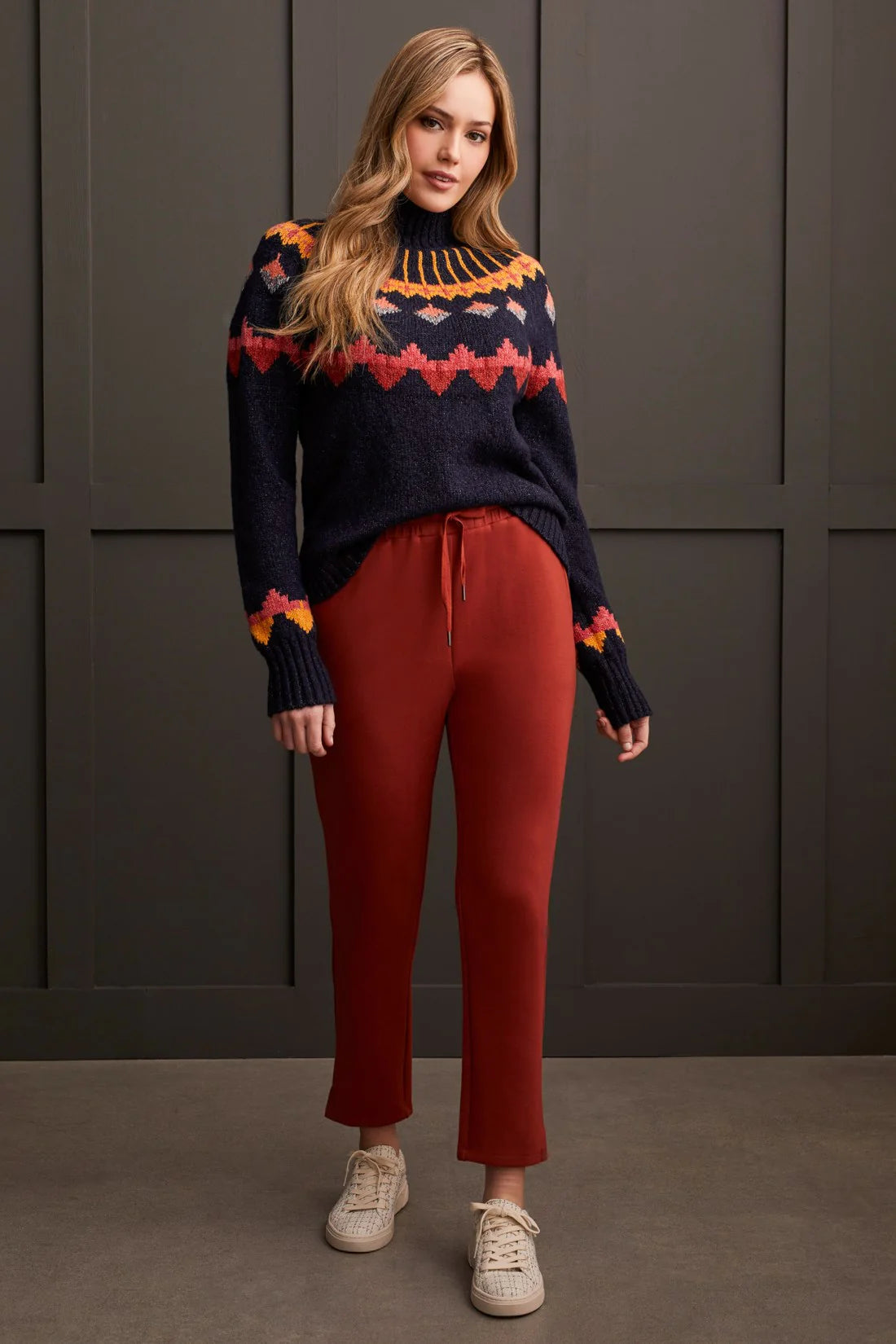 Embrace bold fashion with confidence in this mock neck sweater, featuring vibrant geometric intarsia patterning that adds a pop of colour to chilly days. Designed with a chic pop-over style, long sleeves, and crafted from novelty yarn, it wraps you up in comfort while making a statement with every wear.