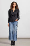 You'll be a vision of captivating cosmopolitan style with this wrap blouse in your collection.