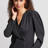 You'll be a vision of captivating cosmopolitan style with this wrap blouse in your collection. 