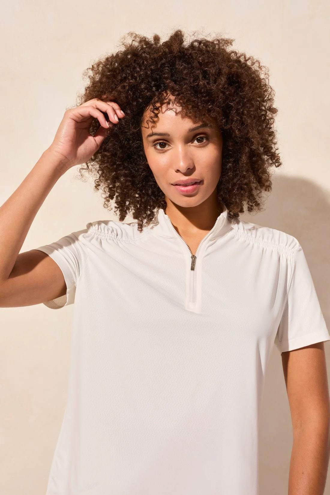 Elevate your sporty charm with this short-sleeve top, crafted from luxuriously soft zigzag pointelle knit. The sophisticated mock neckline is accented by an adjustable zipper, allowing for effortless style and a personalized fit.