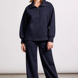 Crafted from knit fabric with a quilted finish, this long-sleeve funnel neck top spoils you with cozy comfort. It's styled with an adjustable half-zip at the neck, a roomy kangaroo pocket, and a high-low hem that's just as flattering as it is practical. Pair them with the matching pants to bring coordinated flair to casual days.