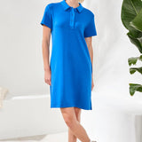 Woman wearing a blue dress with a white background