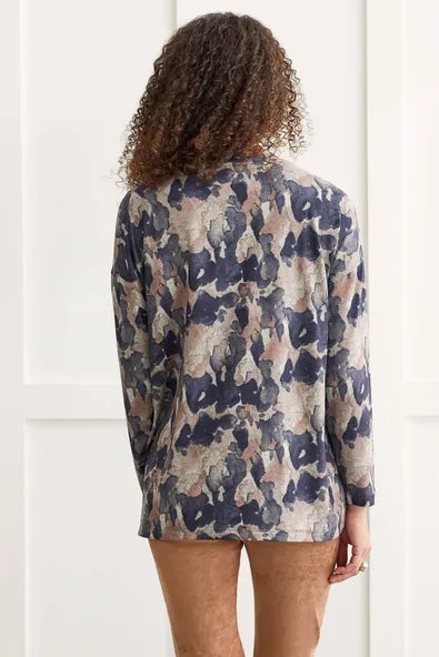 Reinvigorate your regular rotation with this long-sleeve top showcasing a vivacious selection of prints that'll put you at the center of attention