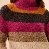 Multicolored striped sweater worn by a person