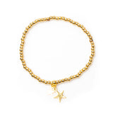 Suzie Blue Elasticated Star Charm Bracelet In Gold Plate