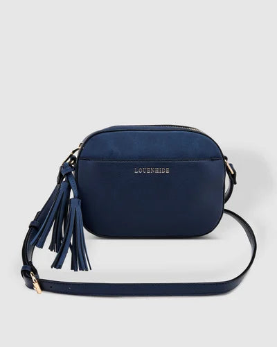 The Louenhide Martina Crossbody Bag is a camera style bag beautifully designed with a stylish pairing of suedette and polyurethane vegan leather. 
